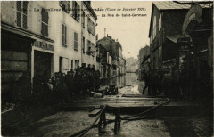 Carte postale ancienne La Banlieue parisienne inondée (Crue de Janvier 1910) - La Rue de Saint-Germain
                                                                     à Courbevoie
                                