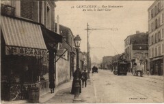 Carte postale ancienne Rue Montmartre - Au loin, le Sacré-Coeur
                                                                     à Saint-Ouen-sur-Seine
                                