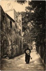 Carte postale ancienne Vieux Montmartre - La Rue Saint-Vincent - Un chansonnier
                                                                     à Paris 18e
                                