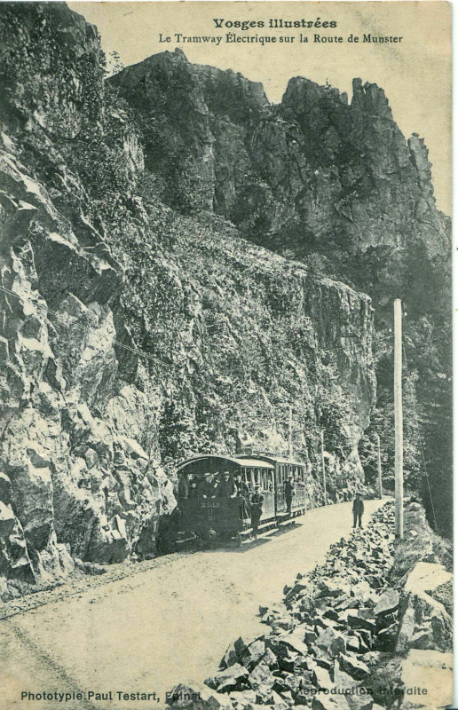 Carte postale ancienne Testard - Vosges illustrées - Le Tramway électrique sur la Route de Munster