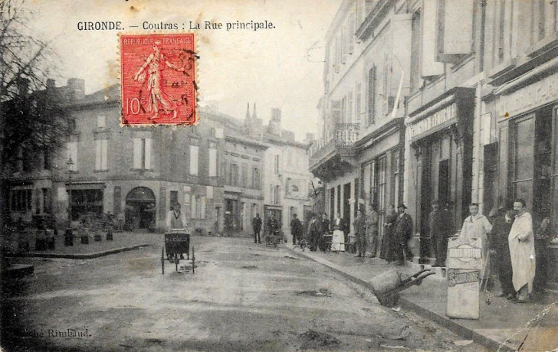 Carte postale ancienne Coutras - rue principale