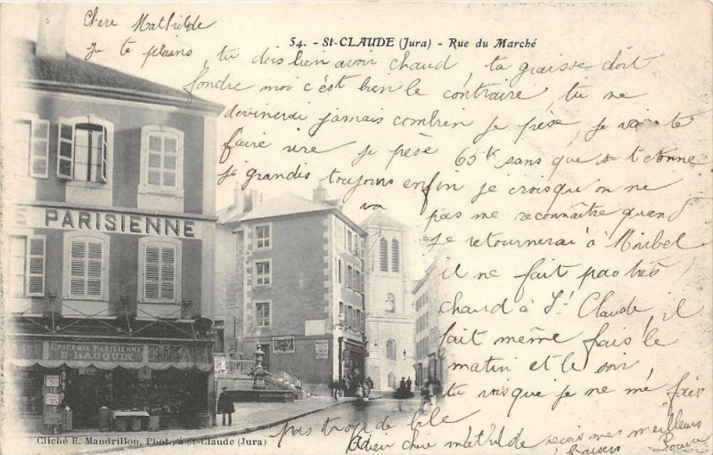 Carte postale ancienne Saint Claude La Rue Du Marche  (dos non divisé) à Saint-Claude