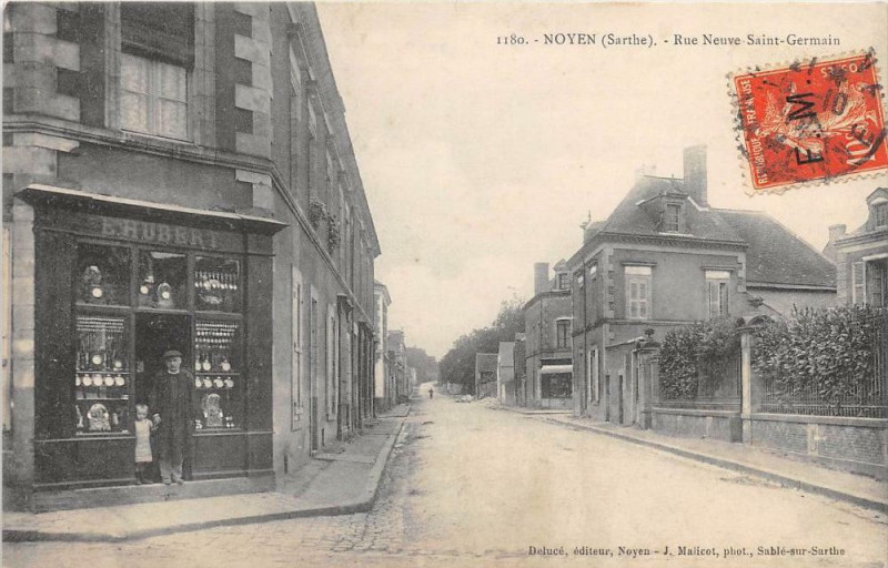 Carte postale ancienne Noyen Rue Neuve Saint Germain (Magasin E.hubert