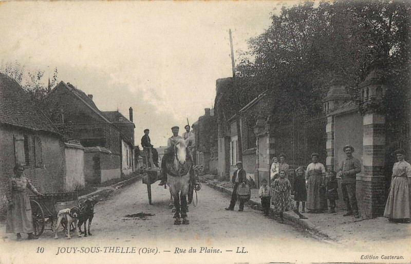 Carte postale ancienne Jouy Sous Thelle Rue Du Plaine ( Attelage A Chien à Jouy-sous-Thelle