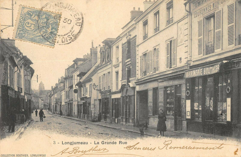 Carte postale ancienne Longjumeau La Grande Rue à Longjumeau