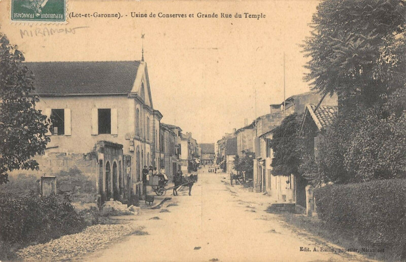 Carte postale ancienne Miramont Usine De Conserves Et Grande Rue Du Temple (cliché pas courant