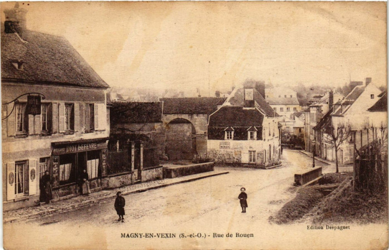 Carte postale ancienne Magny-en-Vexin - Rue de Roquen à Magny-en-Vexin