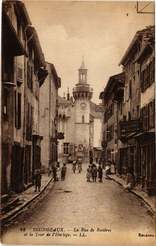 Carte postale ancienne Yssingeaux - La Rue de Roseries et la Tour de l'Horloge à Yssingeaux
