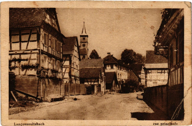 Carte postale ancienne Langensoultzbach - Rue principale à Langensoultzbach