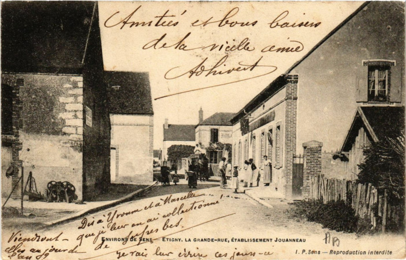 Carte postale ancienne Env. de Sens - Etigny La Grande-Rue Etabl. Jouanneau à Sens