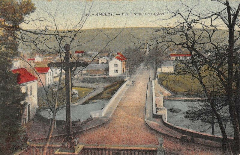 Carte postale ancienne Ambert Vue A Travers Les Arbres (cliché rare à Ambert