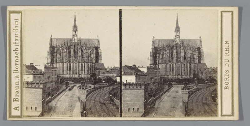 Carte postale ancienne Gezicht op de Dom van Keulen vanaf de Dombrücke Cathédrale - Vue prise du pont de fer (titel op object) Cologne (serietitel op object) Bords du Rhin