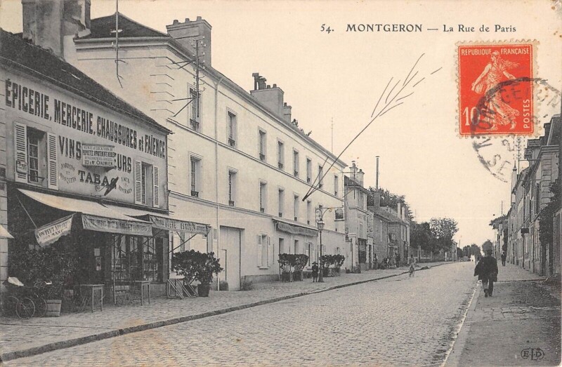 Carte postale ancienne Montgeron - La Rue De Paris - Epincerie - Mercerie - Tabac à Montgeron