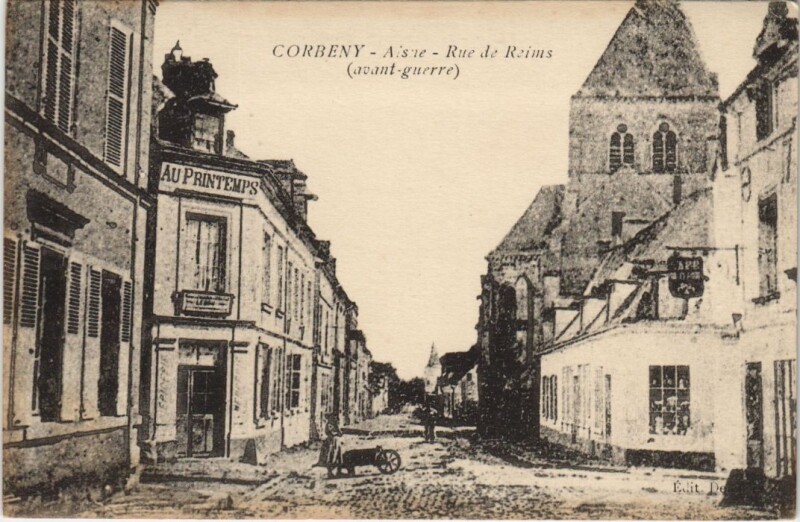 Carte postale ancienne Corbeny - Rue de Reims avant Guerre à Corbeny