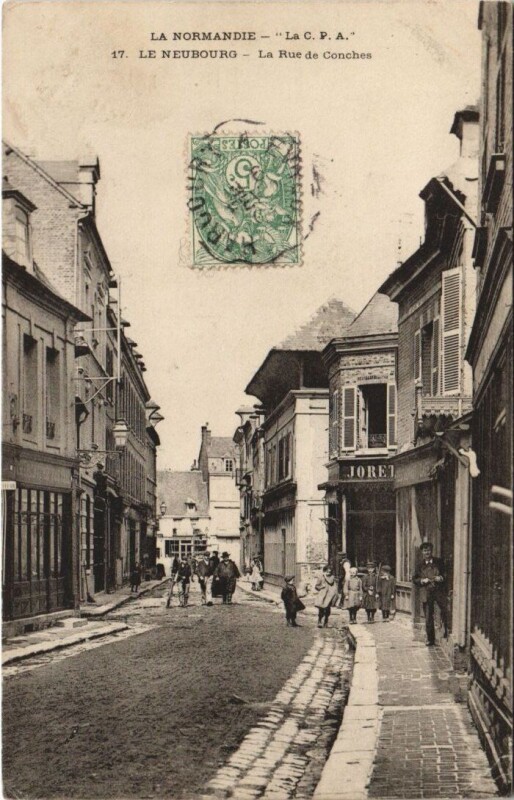 Carte postale ancienne Le Neubourg-La Rue de Conches au Neubourg