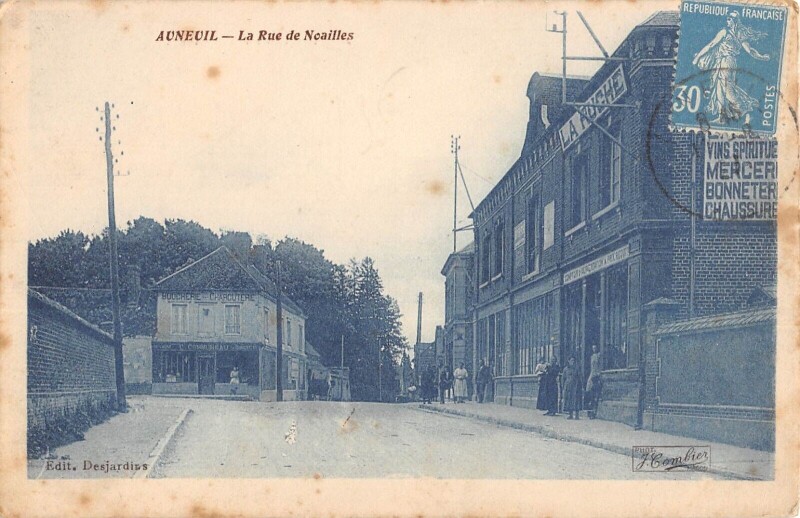 Carte postale ancienne Auneuil - Rue De Noailles - Alimentation La Ruche - Boucherie C.communea à Auneuil