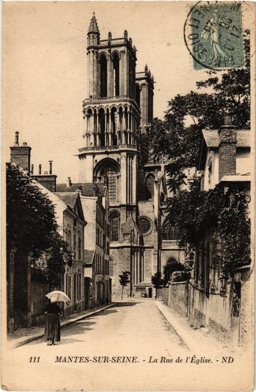 Carte postale ancienne Mantes-la-Jolie La Rue de l'Eglise à Mantes-la-Jolie