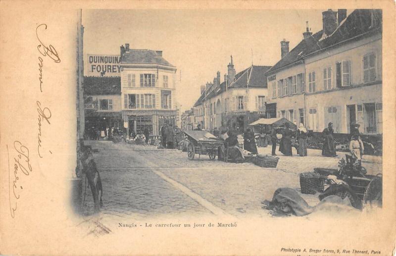 Carte postale ancienne Nangis - Le Carrefour Un Jour De Marche à Nangis